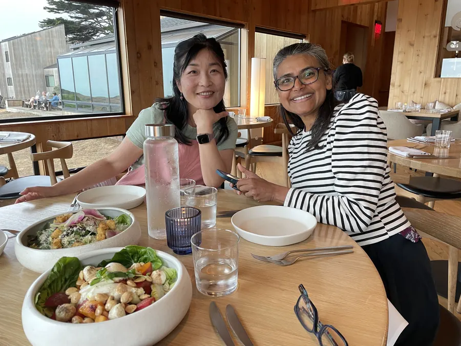 Two friends over salads in the dining room at Sea Ranch Lodge
